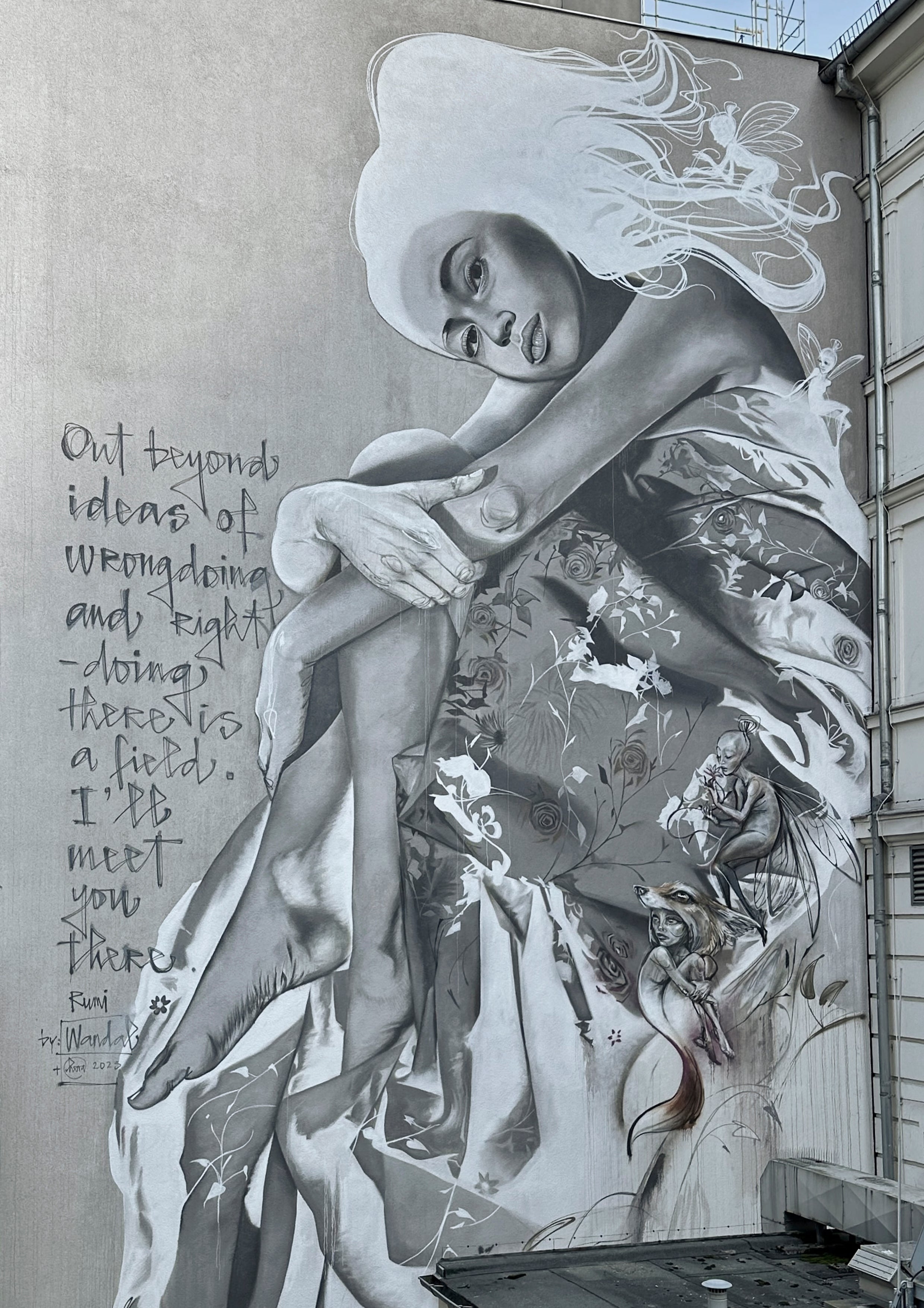 Large scale wall art by contemporary mural artist Wandal featuring a Rumi quote and surreal elements